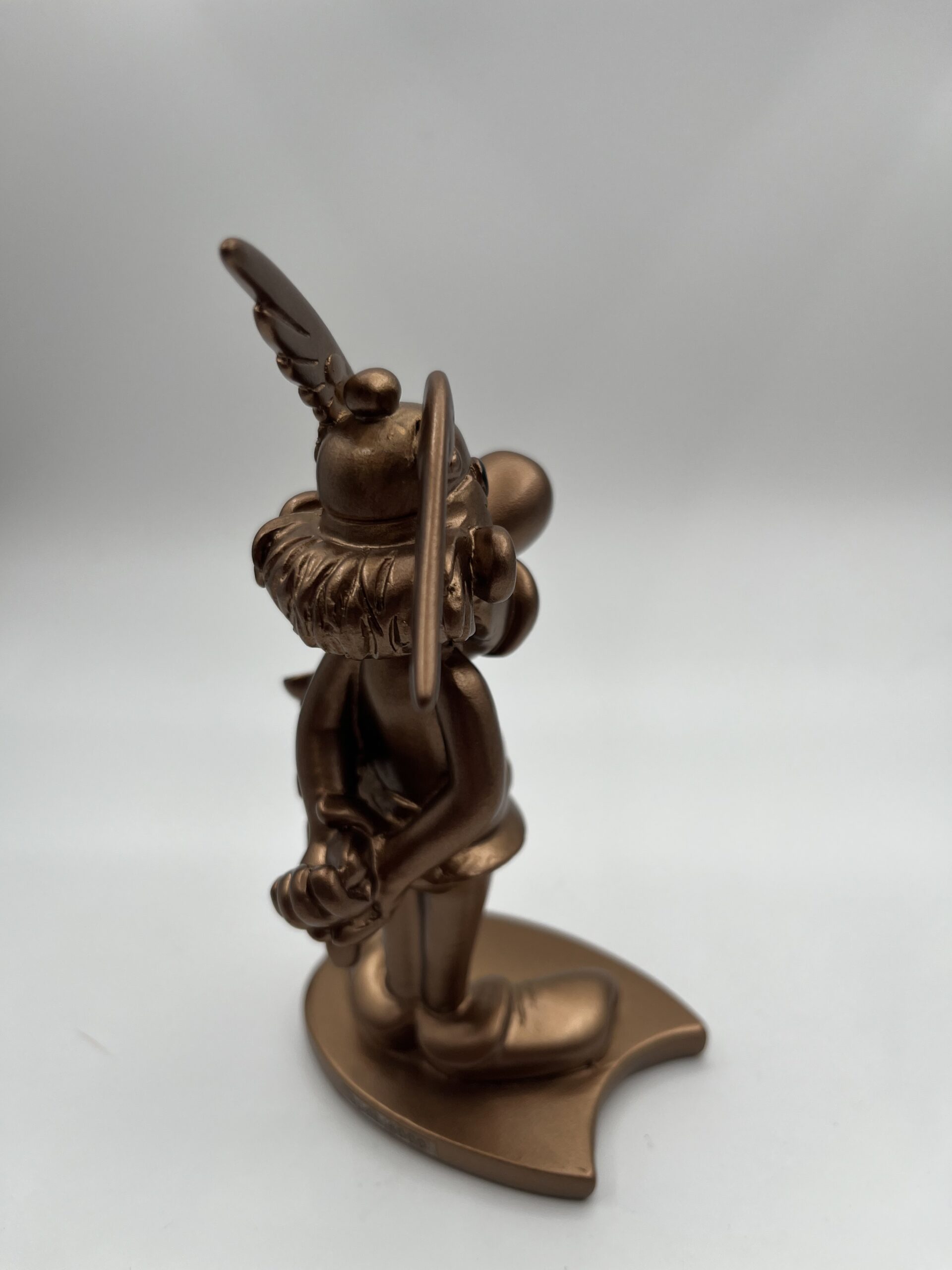 gold asterix figurine back
